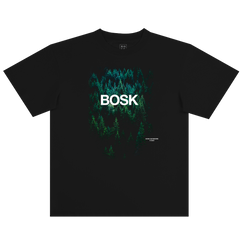 The Forest Brush Tee by BOSK is a black, classic fit 100% cotton shirt with a dense green forest aerial print, bold “BOSK” lettering, and “empty landscapes series 2023” text in the corner.