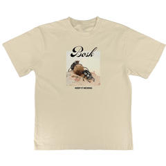 The BOSK Moving Tee is an Off White, classic fit t-shirt featuring a dung beetle graphic on sand with "Bosh" above and “KEEP IT MOVING.” below, all printed on premium heavy-weight cotton.