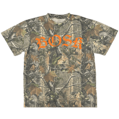 The BOSK Camo Tee is a heavyweight, short-sleeve cotton t-shirt with a green, brown, and beige Tree Camo pattern and bold orange gothic "BOSK" lettering across the chest.
