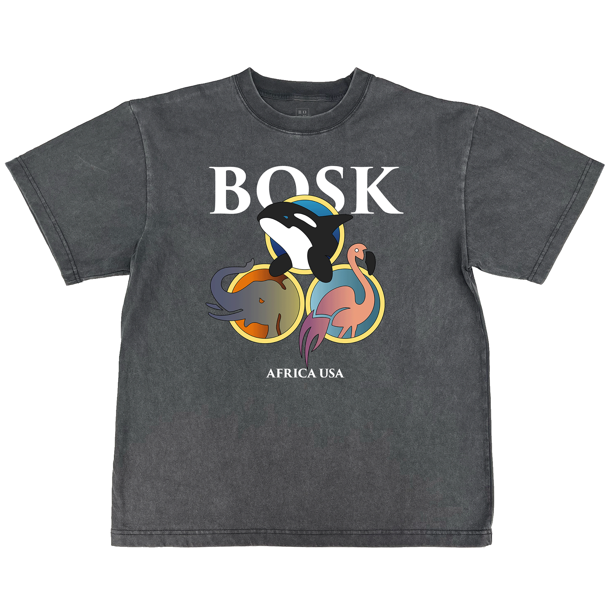 The BOSK World Tee is a classic fit, heavy-weight faded black t-shirt featuring bold white "BOSK" lettering above cartoon orca, elephant, and flamingo in colorful circles and "AFRICA USA" underneath for a casual, worn look.