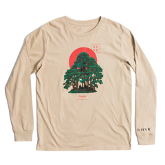 The Rising Sun LS Tee is a beige long-sleeve t-shirt featuring a green tree with a backdrop of a red sun. The word "BOSK" appears vertically at the top right and is also elegantly printed in black on the left sleeve cuff, while the brand name sits at the base of the tree. Designed for men's classic fit to ensure comfort.