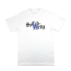 The BOSK Solidarity Tee is a plain white shirt with "Solidarity" in black Old English font, the “LA” in blue inspired by the Dodgers, celebrating art education and unity in Oakland. Displayed on a white background.
